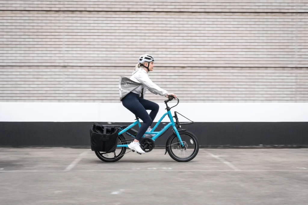 Kim enjoying commute to work on her Quick Haul ebike. As a Lug+Carrie subscriber she doesn't need to stress about parking or traffic.