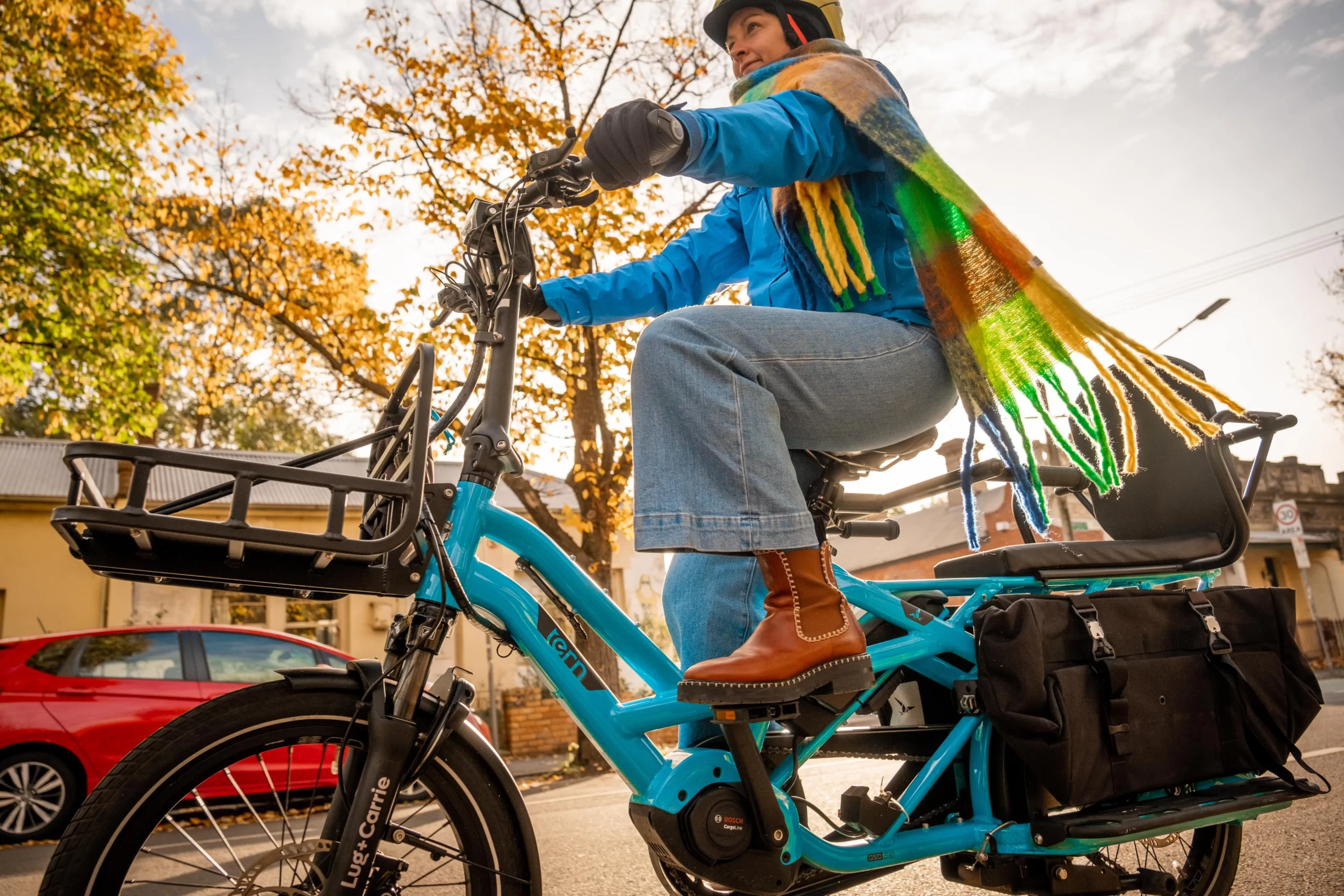 Rachel riding here electric bike in her winter gear.